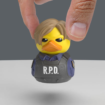 Resident Evil Leon S Kennedy TUBBZ Mini Edition collectible duck, held between finger and thumb to show its size