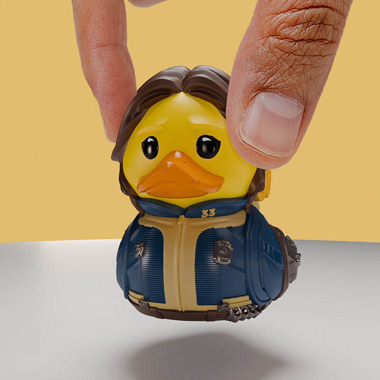 Fallout TV Lucy Maclean TUBBZ Mini Edition collectible duck, held between finger and thumb to show its size