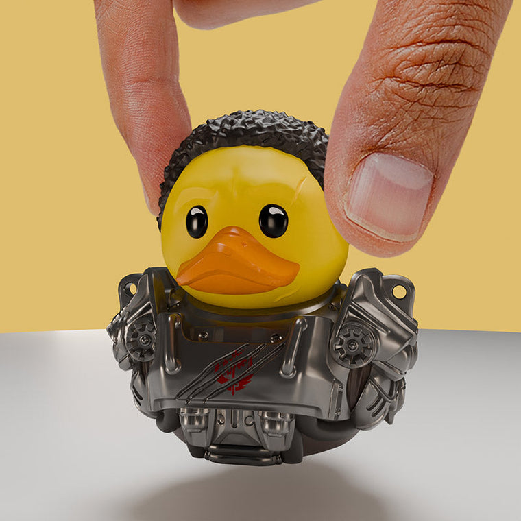 Fallout TV Maximus TUBBZ Mini Edition collectible duck, held between finger and thumb to show its size
